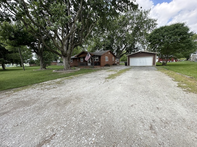 12967 N County Road 825 E, Roachdale, IN 46172 - view of front of property with an outdoor structure, a detached garage, a front lawn, and a porch