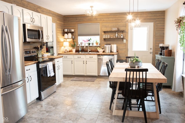 2210 Bridlewood Dr, Franklin, IN 46131 - kitchen featuring appliances with stainless steel finishes, plenty of natural light, open shelves, and white cabinets