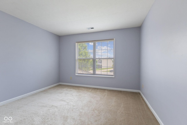 5852 Long Ridge Pl, Indianapolis, IN 46221 - spare room with carpet floors and baseboards