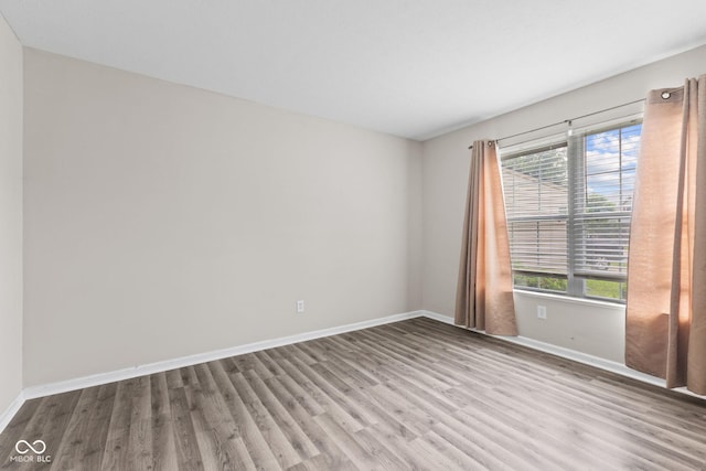 5852 Long Ridge Pl, Indianapolis, IN 46221 - empty room featuring wood finished floors and baseboards