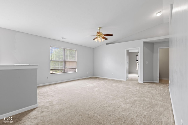 5852 Long Ridge Pl, Indianapolis, IN 46221 - carpeted empty room featuring a ceiling fan, vaulted ceiling, and baseboards