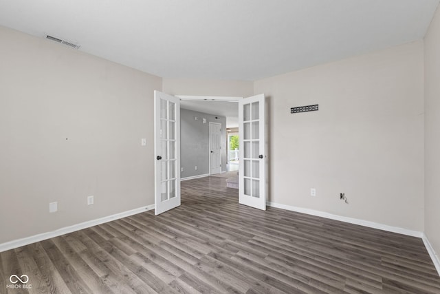 5852 Long Ridge Pl, Indianapolis, IN 46221 - unfurnished room featuring french doors, wood finished floors, and baseboards