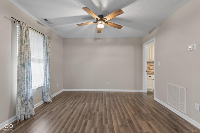 5852 Long Ridge Pl, Indianapolis, IN 46221 - unfurnished room featuring plenty of natural light, dark wood-type flooring, and a ceiling fan