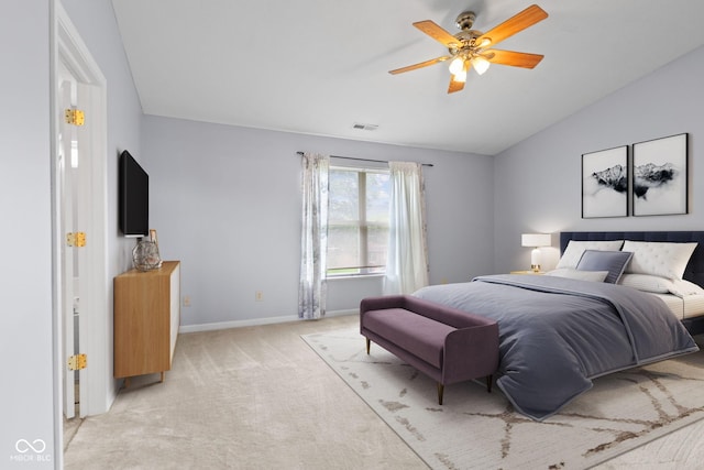 5852 Long Ridge Pl, Indianapolis, IN 46221 - bedroom with vaulted ceiling, light colored carpet, baseboards, and a ceiling fan