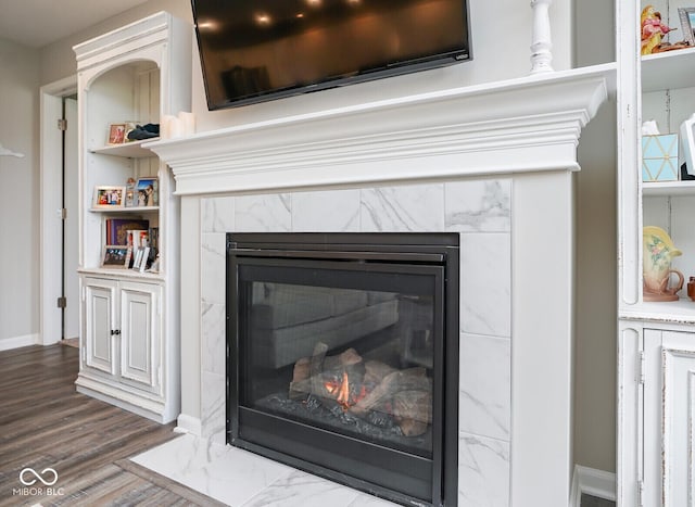 7184 Lillian Pl, Cumberland, IN 46229 - detailed view of a fireplace, baseboards, and wood finished floors