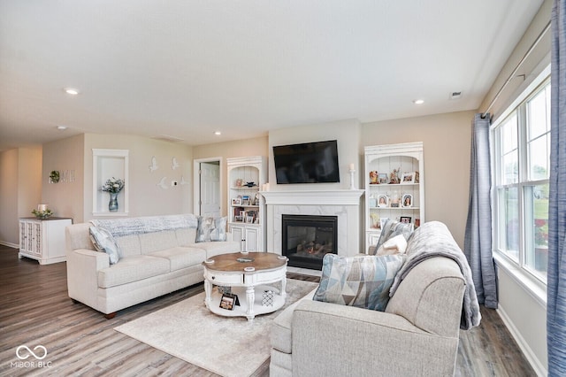 7184 Lillian Pl, Cumberland, IN 46229 - living room featuring wood finished floors, baseboards, a high end fireplace, and recessed lighting
