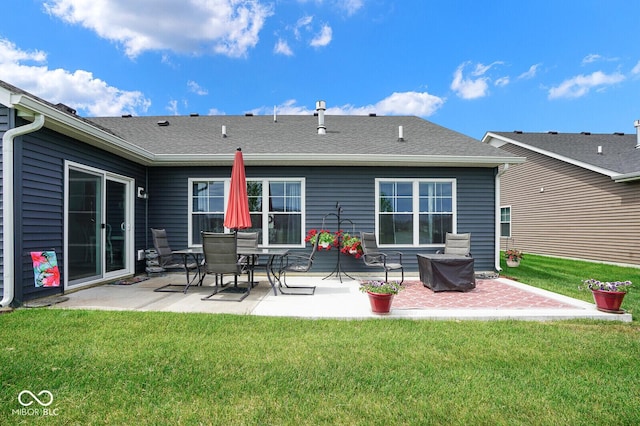 7184 Lillian Pl, Cumberland, IN 46229 - back of house with a patio, a lawn, and a shingled roof