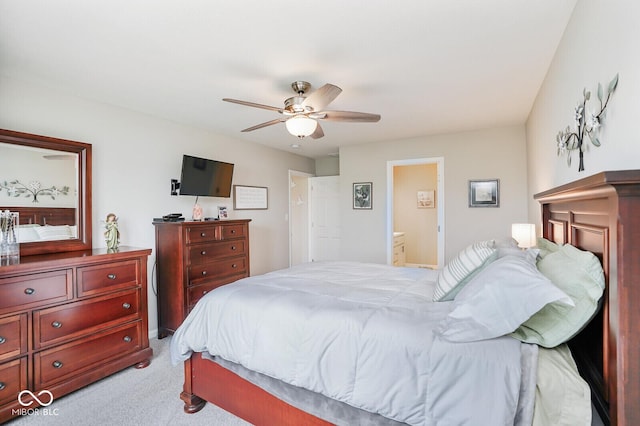 7184 Lillian Pl, Cumberland, IN 46229 - bedroom with light colored carpet, a ceiling fan, and ensuite bathroom