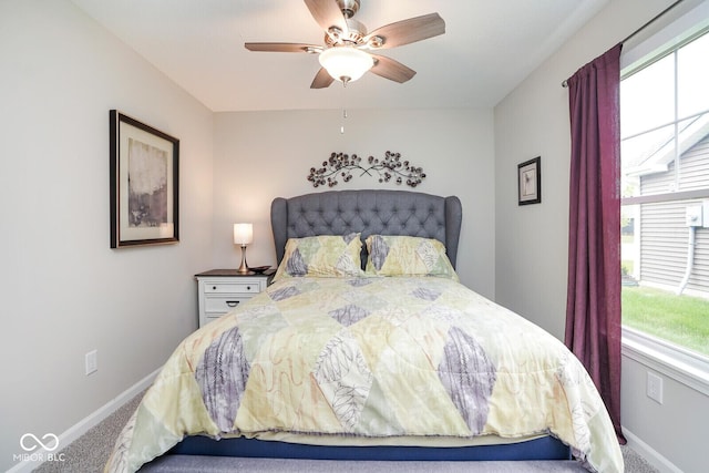 7184 Lillian Pl, Cumberland, IN 46229 - carpeted bedroom featuring baseboards and a ceiling fan