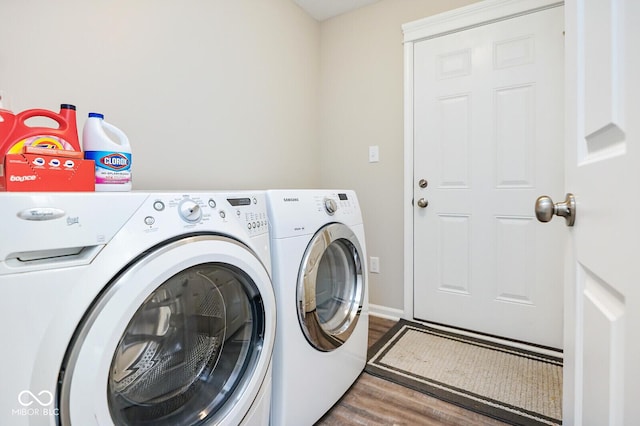 7184 Lillian Pl, Cumberland, IN 46229 - laundry area with washing machine and clothes dryer and wood finished floors