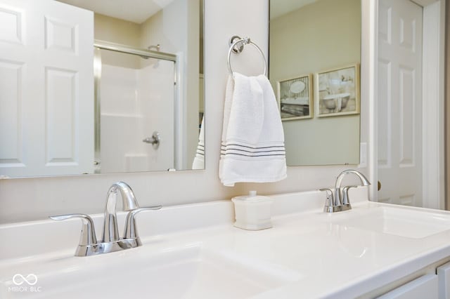 7184 Lillian Pl, Cumberland, IN 46229 - full bathroom featuring a stall shower and double vanity
