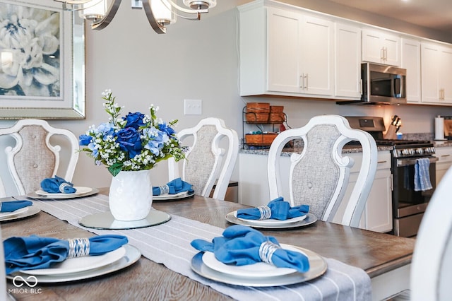 7184 Lillian Pl, Cumberland, IN 46229 - dining area featuring a chandelier