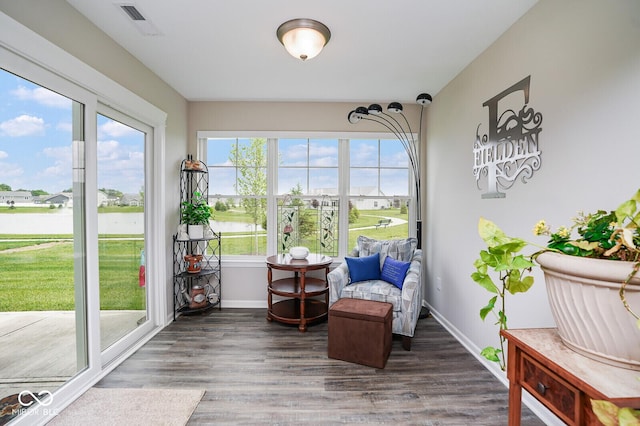7184 Lillian Pl, Cumberland, IN 46229 - sunroom with baseboards, wood finished floors, and a water view