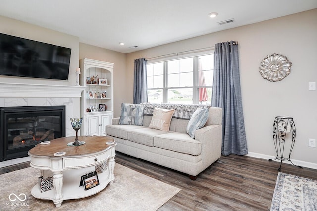 7184 Lillian Pl, Cumberland, IN 46229 - living area featuring wood finished floors, a premium fireplace, baseboards, and recessed lighting