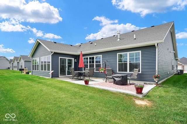 7184 Lillian Pl, Cumberland, IN 46229 - rear view of property with a patio area, a yard, central air condition unit, and a shingled roof