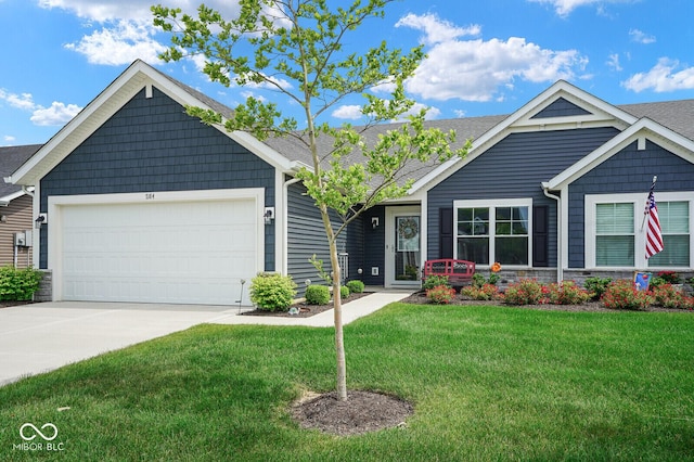 7184 Lillian Pl, Cumberland, IN 46229 - view of front of home featuring a front yard, an attached garage, and driveway