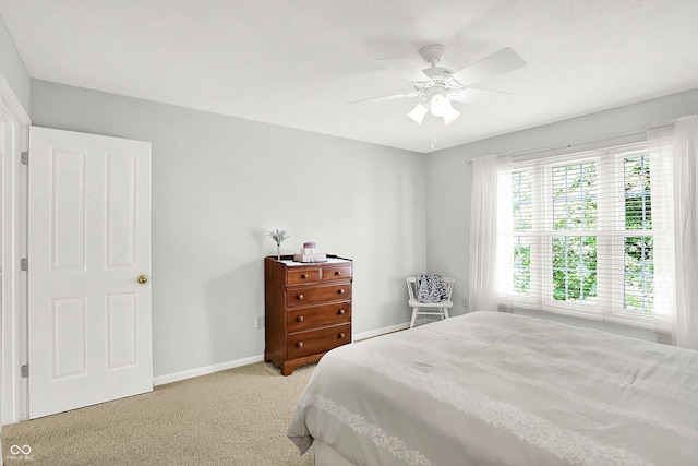 10965 Fairway Ridge Ln, Fishers, IN 46037 - bedroom featuring baseboards, light colored carpet, and a ceiling fan