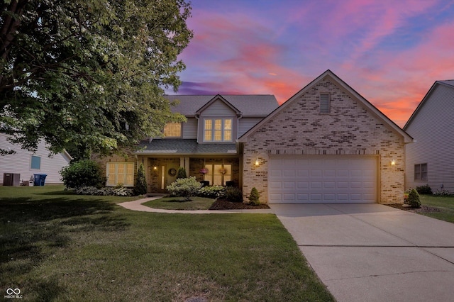 10965 Fairway Ridge Ln, Fishers, IN 46037 - view of front of property featuring brick siding, concrete driveway, and a front yard