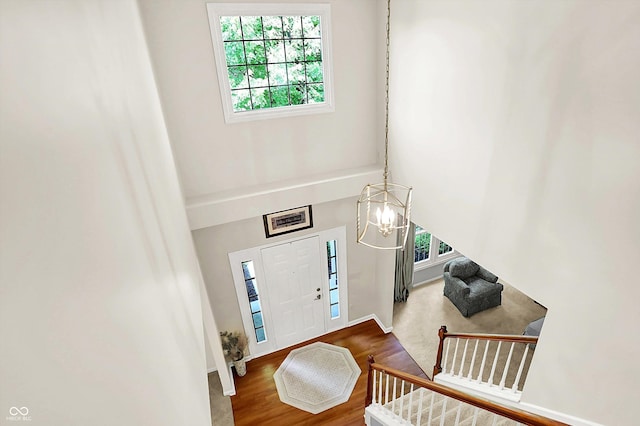 10965 Fairway Ridge Ln, Fishers, IN 46037 - foyer entrance with wood finished floors, baseboards, and a chandelier