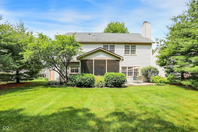 10965 Fairway Ridge Ln, Fishers, IN 46037 - rear view of house with a chimney, a sunroom, and a lawn