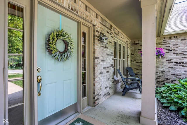 10965 Fairway Ridge Ln, Fishers, IN 46037 - view of exterior entry featuring brick siding and covered porch