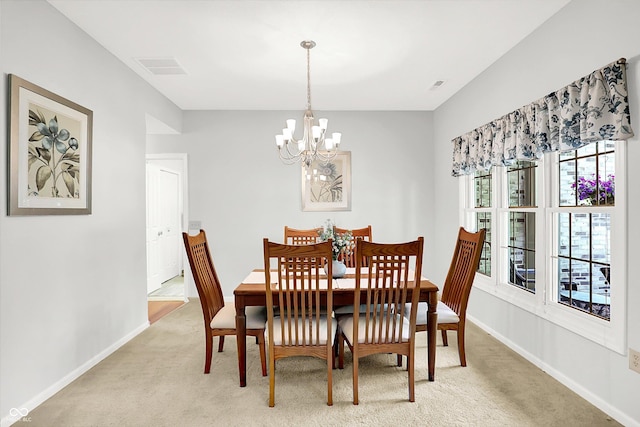 10965 Fairway Ridge Ln, Fishers, IN 46037 - dining space with a chandelier, light carpet, and baseboards