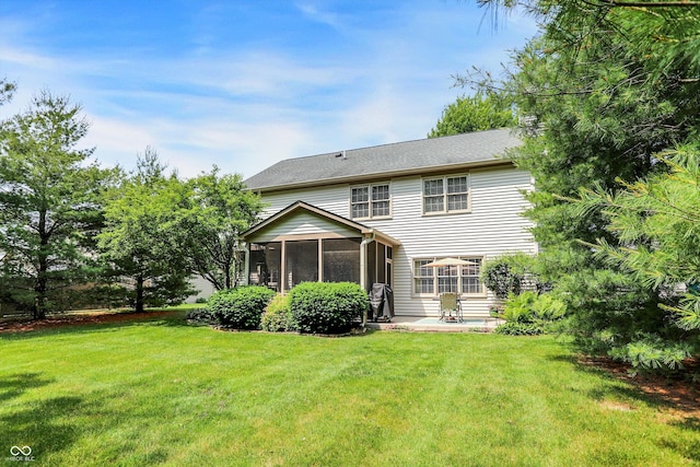 10965 Fairway Ridge Ln, Fishers, IN 46037 - rear view of house with a sunroom, a lawn, and a patio area