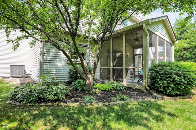 10965 Fairway Ridge Ln, Fishers, IN 46037 - view of side of home featuring a sunroom, cooling unit, a ceiling fan, and a lawn