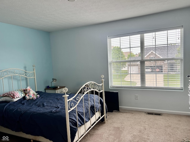 1518 Valdarno Dr, Greenwood, IN 46143 - bedroom featuring carpet, a textured ceiling, and baseboards