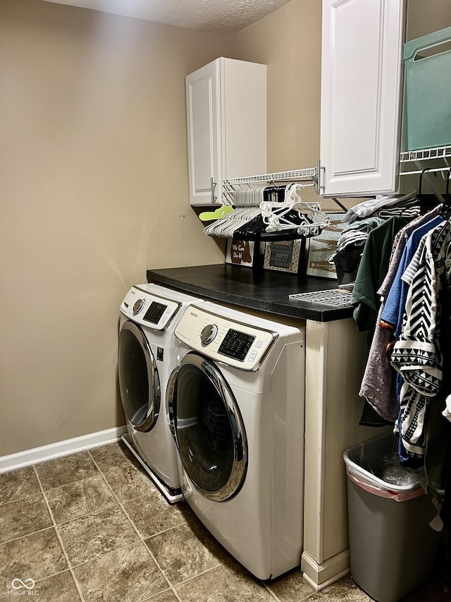 1518 Valdarno Dr, Greenwood, IN 46143 - laundry area with cabinet space, washing machine and dryer, and baseboards