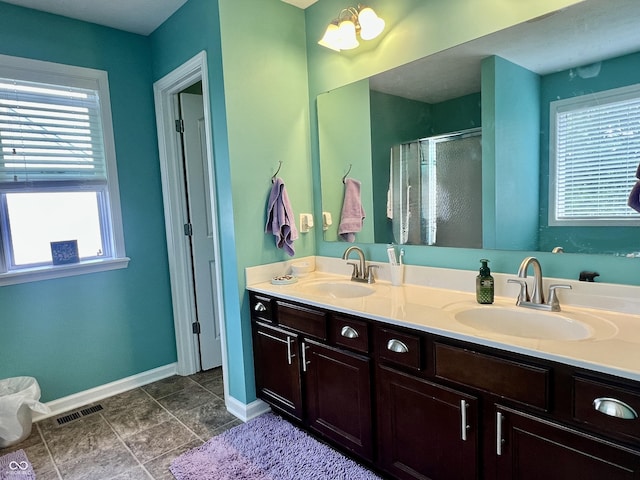 1518 Valdarno Dr, Greenwood, IN 46143 - full bath with baseboards, a stall shower, and double vanity