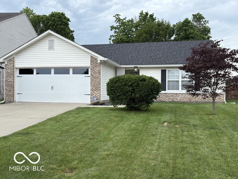 7022 Cordova Dr, Indianapolis, IN 46221 - single story home featuring an attached garage, brick siding, concrete driveway, and a front yard