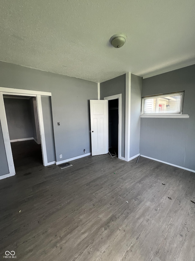409 Parkway Ave, Indianapolis, IN 46225 - empty room featuring wood finished floors, baseboards, and a textured ceiling
