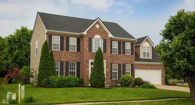 colonial-style house featuring driveway, brick siding, a front lawn, and a shingled roof