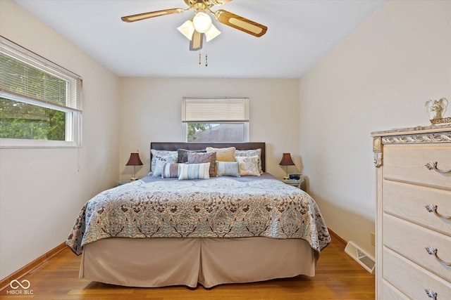 580 Northgate Dr, Greenwood, IN 46143 - bedroom featuring wood finished floors, baseboards, and ceiling fan