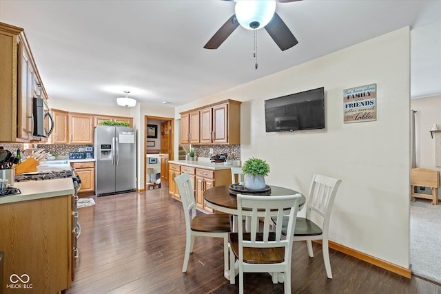 580 Northgate Dr, Greenwood, IN 46143 - dining area featuring a ceiling fan, dark wood-type flooring, and baseboards