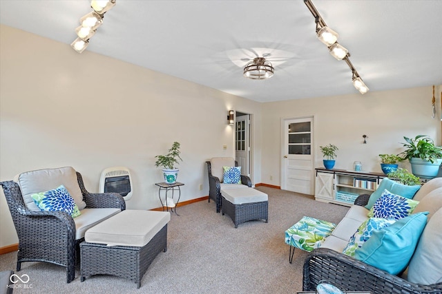 580 Northgate Dr, Greenwood, IN 46143 - living room featuring carpet floors, baseboards, heating unit, and rail lighting