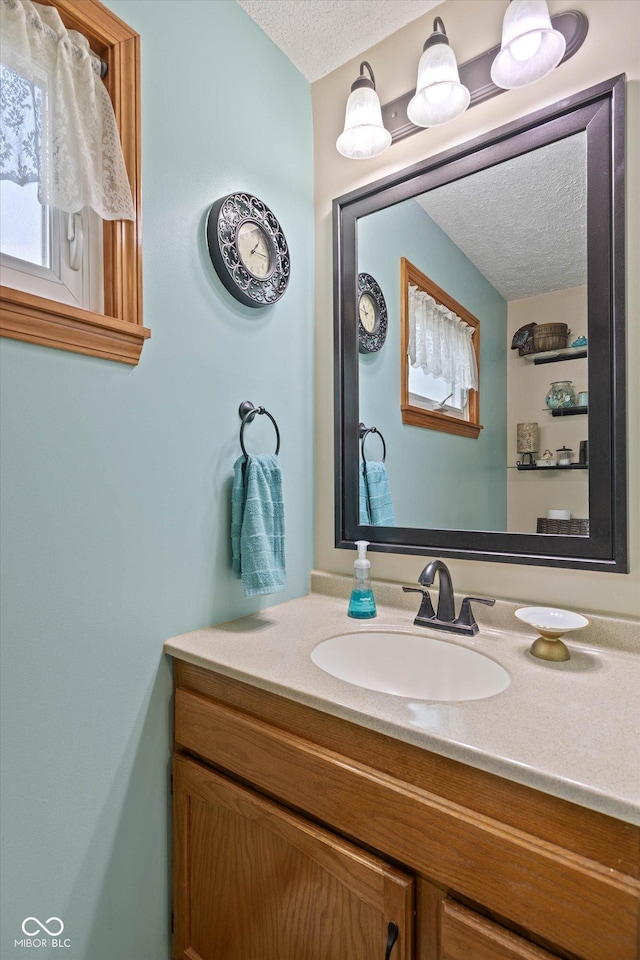 580 Northgate Dr, Greenwood, IN 46143 - bathroom featuring a textured ceiling and vanity