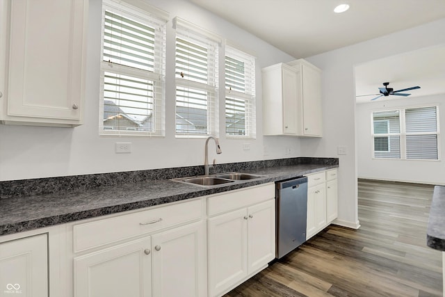 5125 Lilium Dr, Plainfield, IN 46168 - kitchen with stainless steel dishwasher, dark countertops, a ceiling fan, dark wood-style floors, and white cabinetry