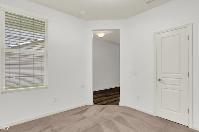 5125 Lilium Dr, Plainfield, IN 46168 - carpeted empty room with healthy amount of natural light and a smoke detector