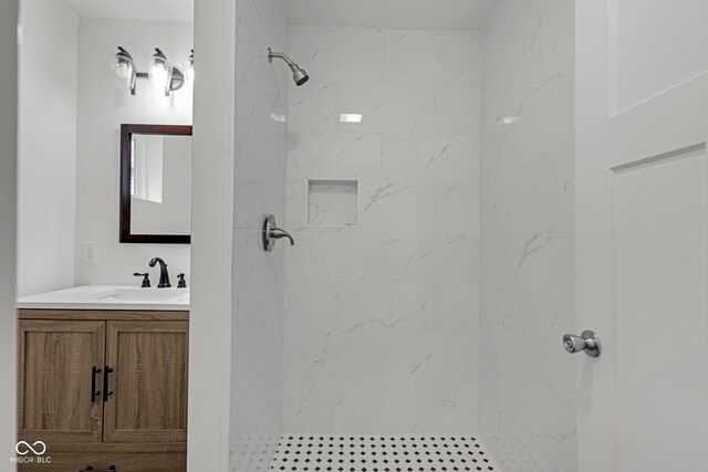 1411 N Grant Ave, Indianapolis, IN 46201 - bathroom with a tile shower and vanity
