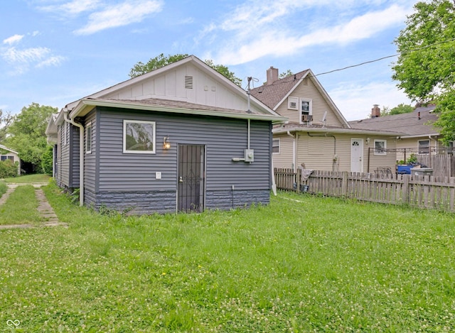 1411 N Grant Ave, Indianapolis, IN 46201 - rear view of property featuring board and batten siding