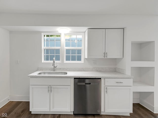 1411 N Grant Ave, Indianapolis, IN 46201 - kitchen with stainless steel dishwasher, a sink, light stone countertops, and baseboards
