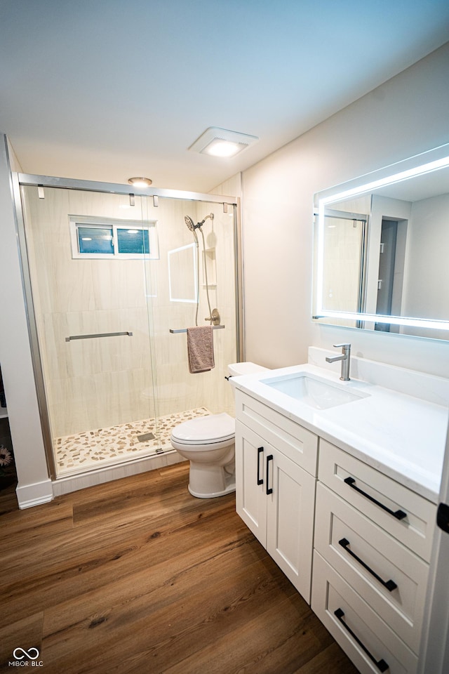 3463 Plum Creek Rd, Nashville, IN 47448 - full bathroom featuring vanity, toilet, a shower stall, and wood finished floors