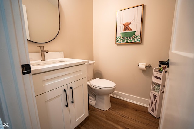 3463 Plum Creek Rd, Nashville, IN 47448 - half bath featuring wood finished floors, toilet, baseboards, and vanity
