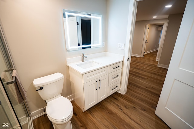 3463 Plum Creek Rd, Nashville, IN 47448 - bathroom with vanity, wood finished floors, toilet, baseboards, and recessed lighting