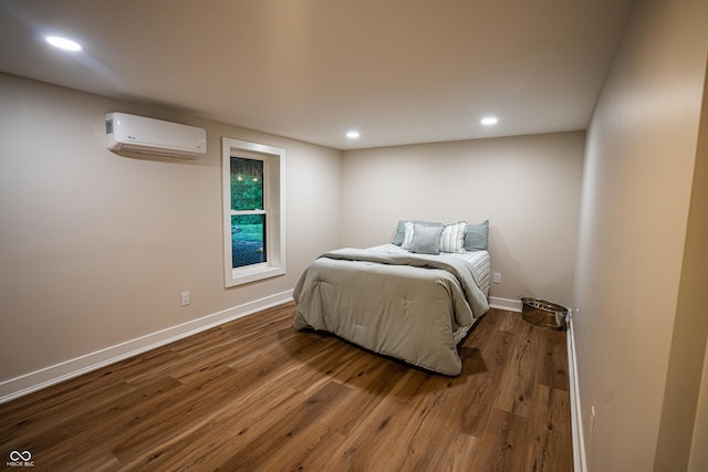 3463 Plum Creek Rd, Nashville, IN 47448 - bedroom with a wall unit AC, dark wood-style flooring, baseboards, and recessed lighting