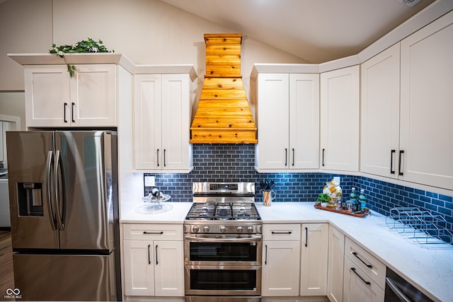 3463 Plum Creek Rd, Nashville, IN 47448 - kitchen featuring stainless steel appliances, vaulted ceiling, backsplash, custom exhaust hood, and white cabinetry