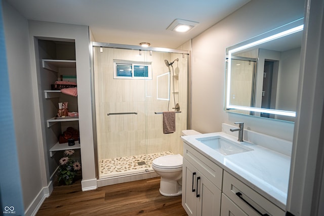 3463 Plum Creek Rd, Nashville, IN 47448 - full bath with toilet, a stall shower, vanity, and wood finished floors