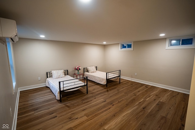 3463 Plum Creek Rd, Nashville, IN 47448 - sitting room featuring a wall mounted air conditioner, wood finished floors, recessed lighting, and baseboards